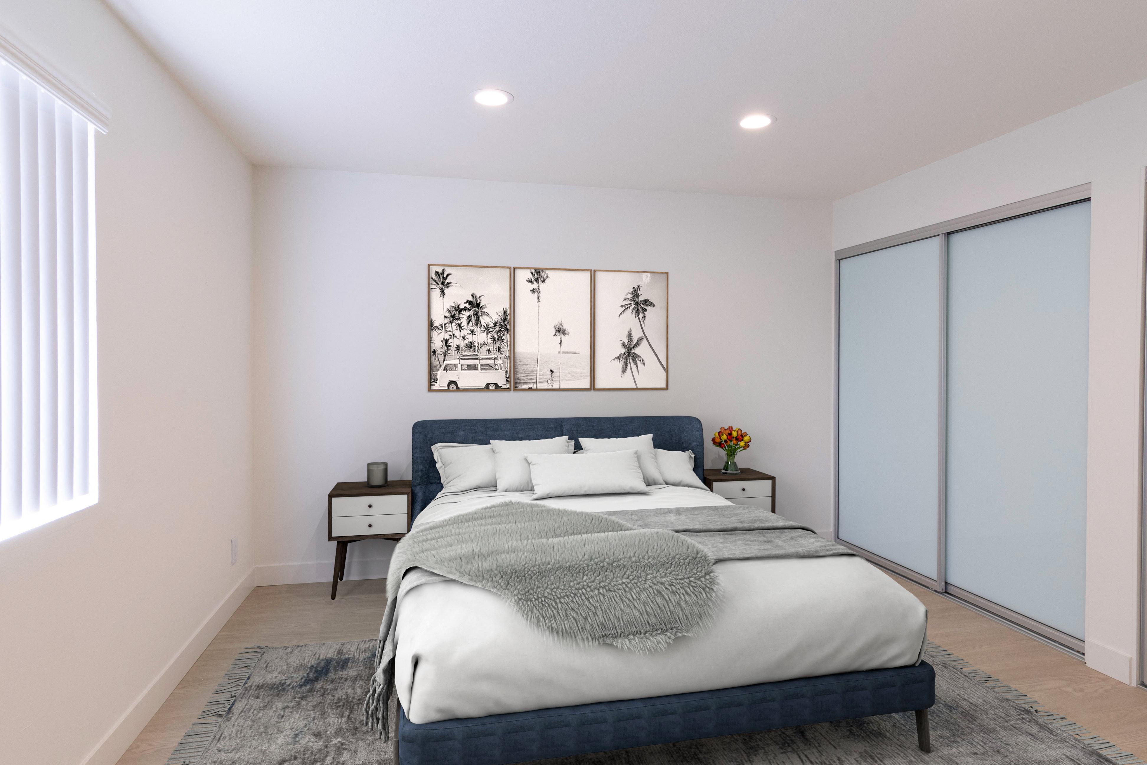 a bedroom with a bed and two nightstands